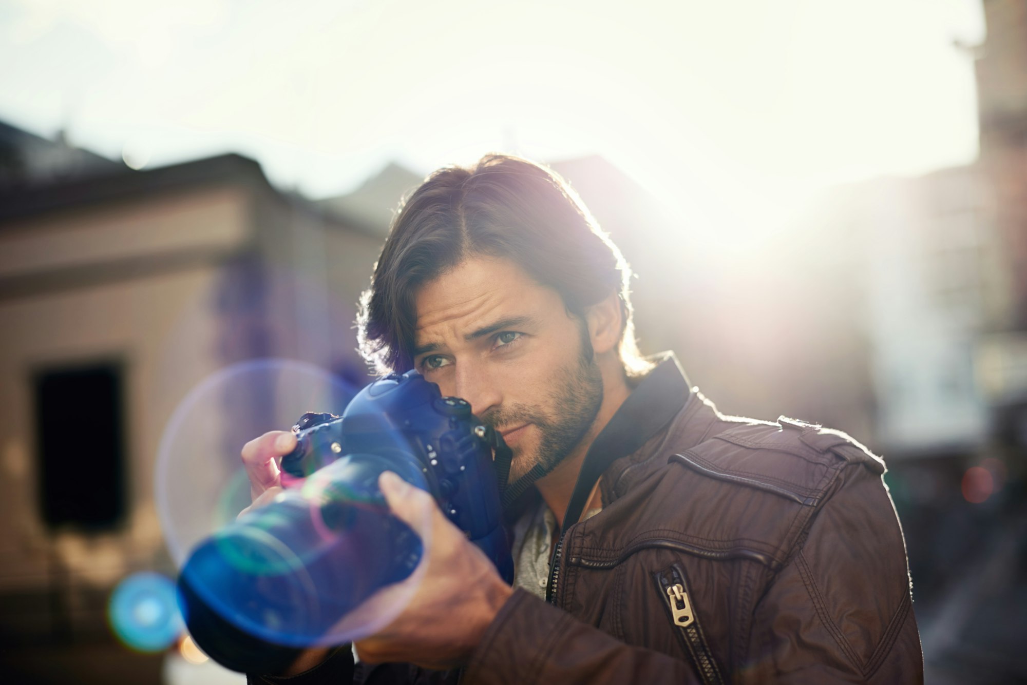 Photography is my passion. Shot of a handsome young photographer at work in the city.